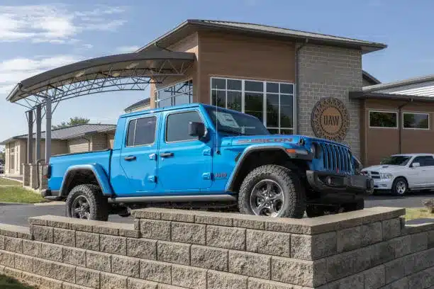 blue Jeep on a UAW strike forecourt